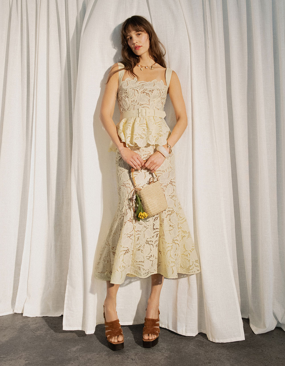 A picture of a woman wearing Yellow Lace Peplum Midi Dress