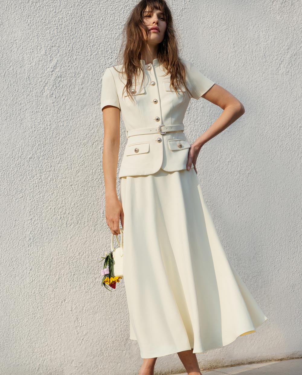 A photo of a woman wearing the WHITE COTTON GATHERED MINI DRESS