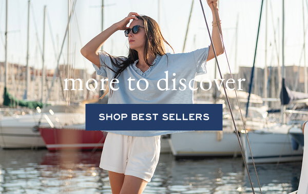 More to Discover - Shop Best Sellers - Image of a woman standing on a boat