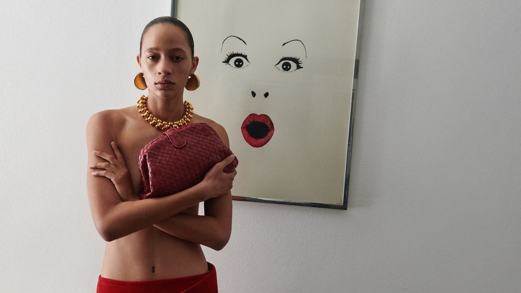 Model holding a Bottega Veneta bag