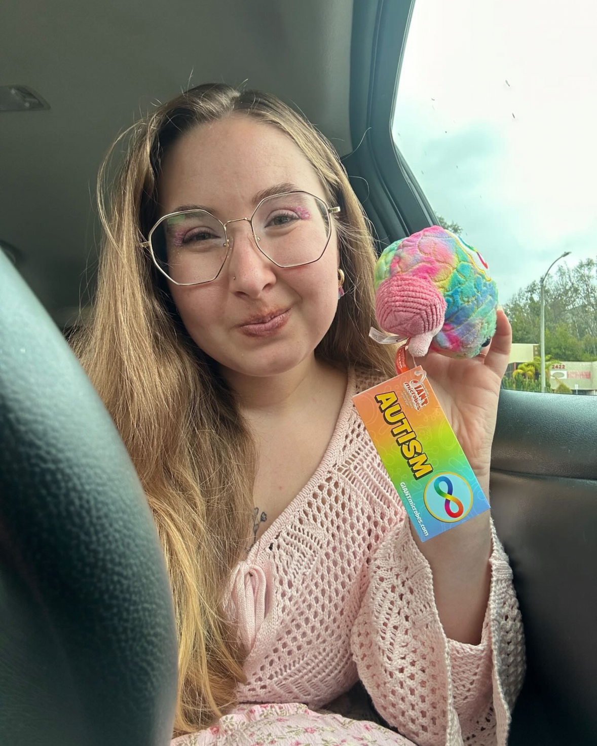 Clark holding Autism plushie