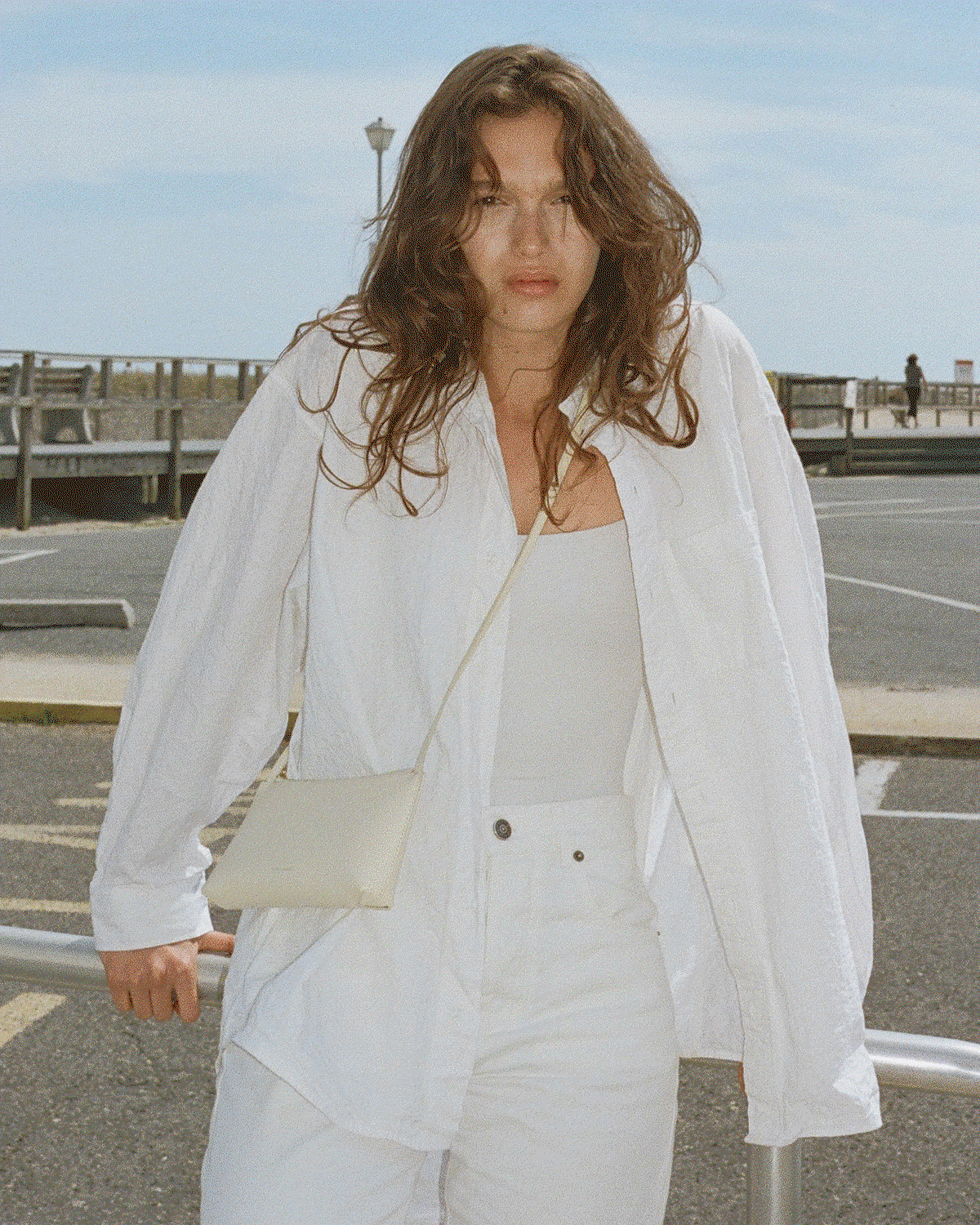 Slender and quietly considered, the Gaia is crafted from polished Italian leather with a slim strap and a clean zip closure.