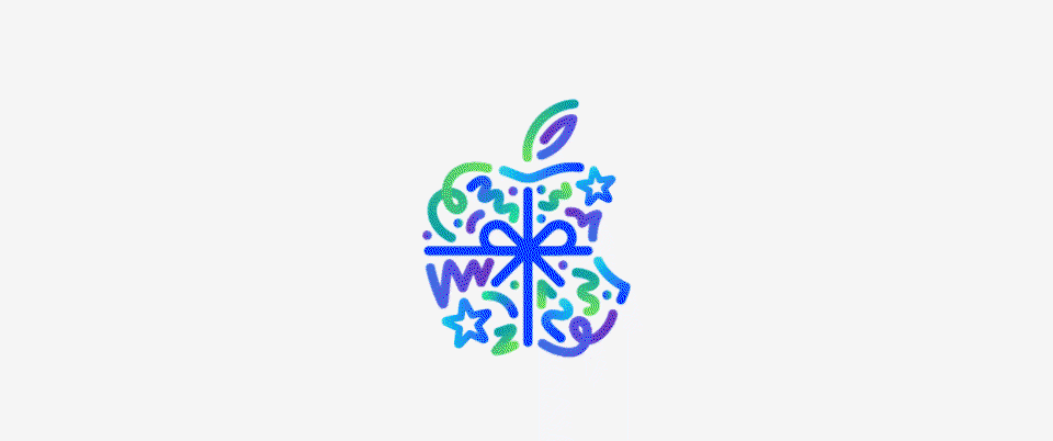 Dot, squiggle, spiral, and star shapes in different hues of blue, green, and purple burst and spread across from behind Apple logo, wrapped in a blue color bow, made up of dots, squiggles, spirals, and star shapes in different hues of blue, green, and purple