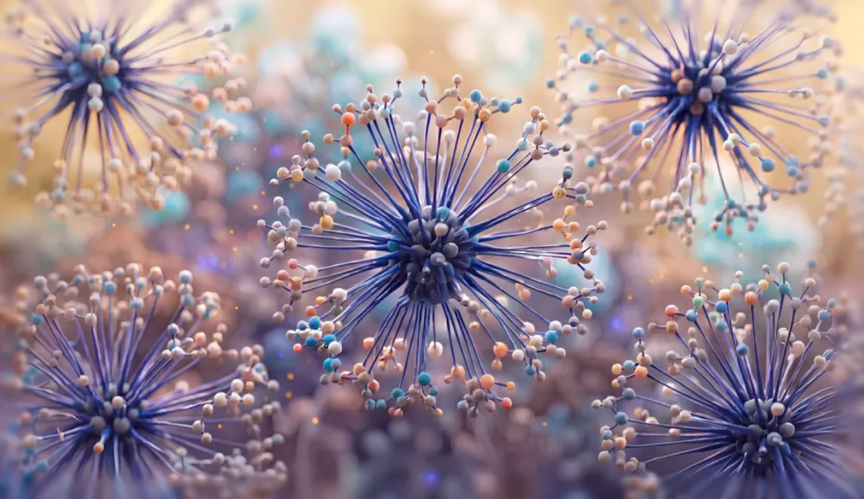 Stylized blue microscopic spheres with radiating, multicolored-tipped fibers.