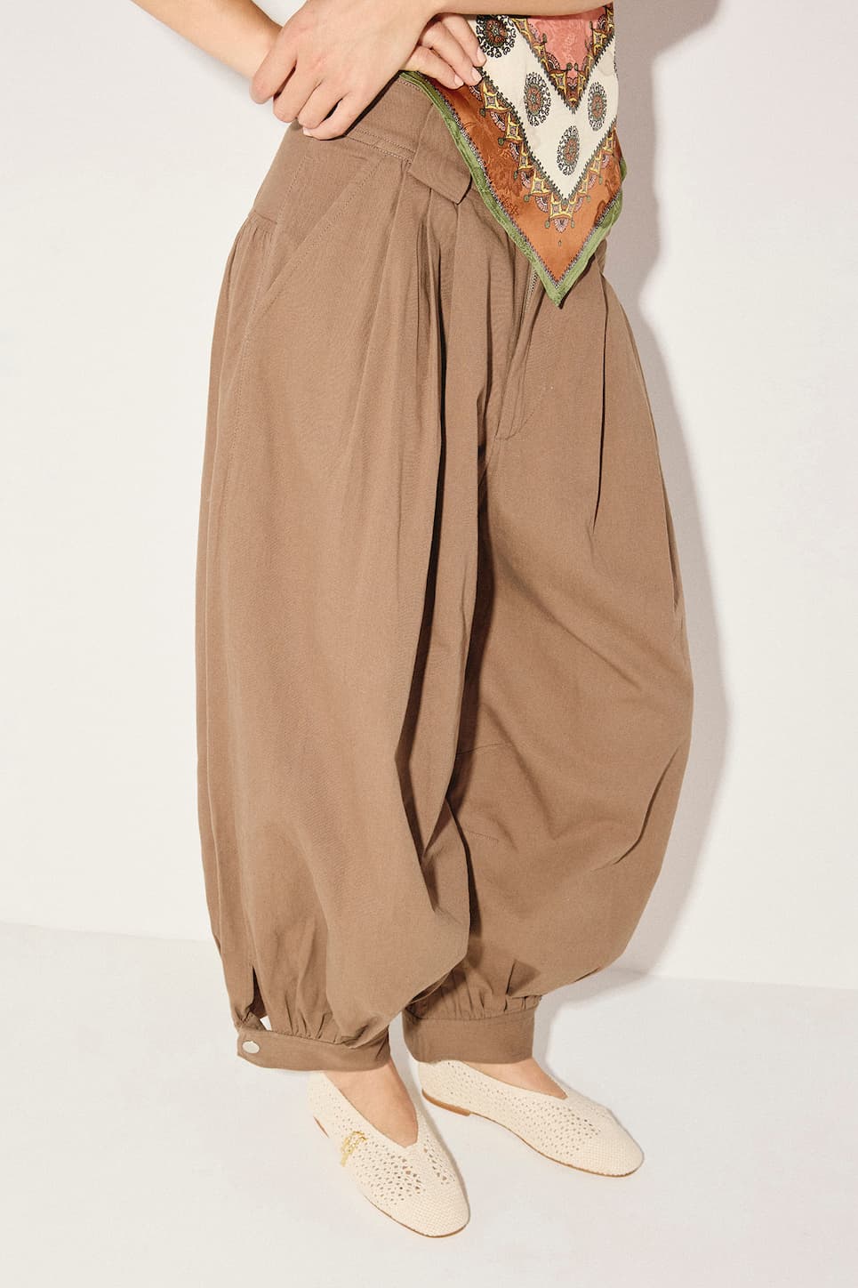 women in brown balloon pants with crochet flat