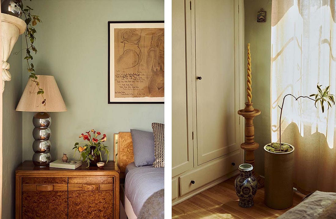 Serene green bedroom with burl wood nightstand; Decor accents on floor in front of closet