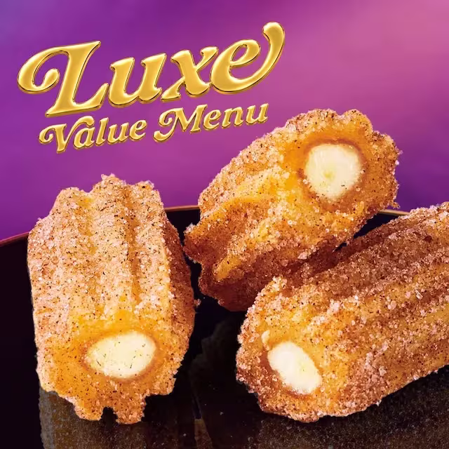 A close-up of three Salted Caramel Mini Churros from Taco Bell's Luxe Value Menu.