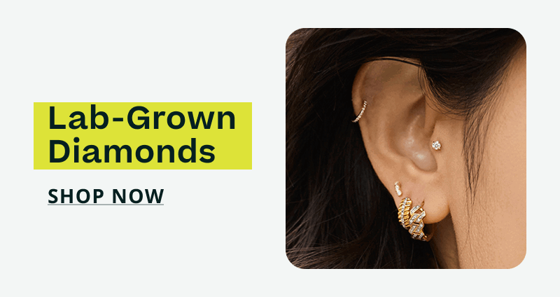 Ear featuring silver tragus stud, cartilage hoop & geometric studs. Sterling silver. Click here to shop now