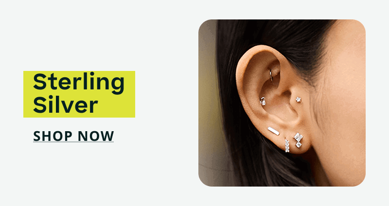Ear featuring a delicate helix hoop, central stud & textured diamond-encrusted hoops. Lab-grown diamonds. Click here to shop now