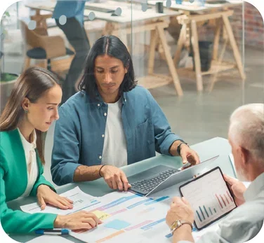 image-colleagues-gathered-around-charts-analyzing-data