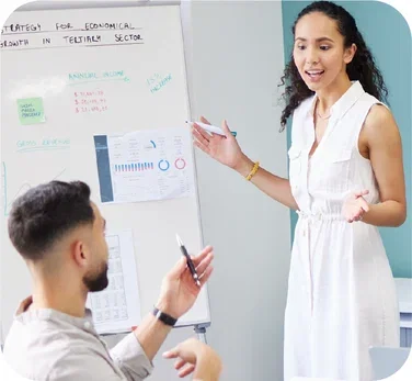 image-colleagues-having-conversation-in-front-of-whiteboard-with-data