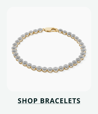 Gold bracelet with continuous circular diamond clusters. Click here to shop bracelets