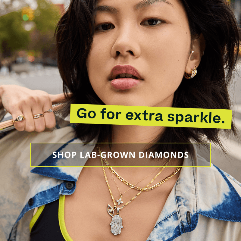 Model in gold-set diamond detailed jewelry. Go for sparkle. Click here to shop lab-grown diamonds