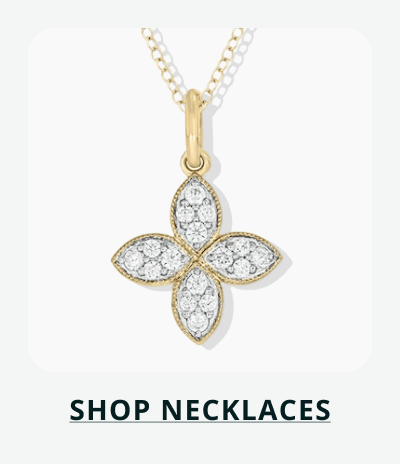 Gold chain with four-petal clover pendant pavé-set with stones. Click here to shop necklaces
