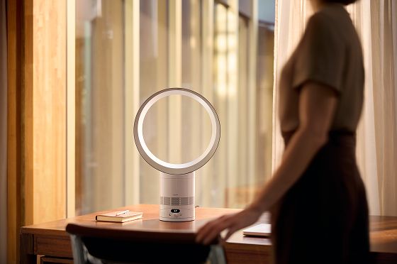 A Dyson fan placed on a desk for personalised cooling.