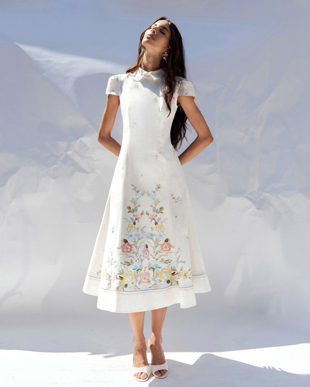 A picture of a woman in the White Floral Linen Blend Midi Dress