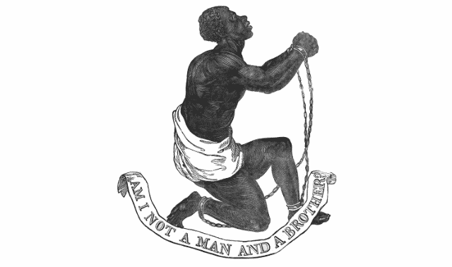 Black and white depiction of an enslaved man kneeling with chains on his wrists and ankles. A banner beneath him reads "Am I Not a Man and a Brother?.