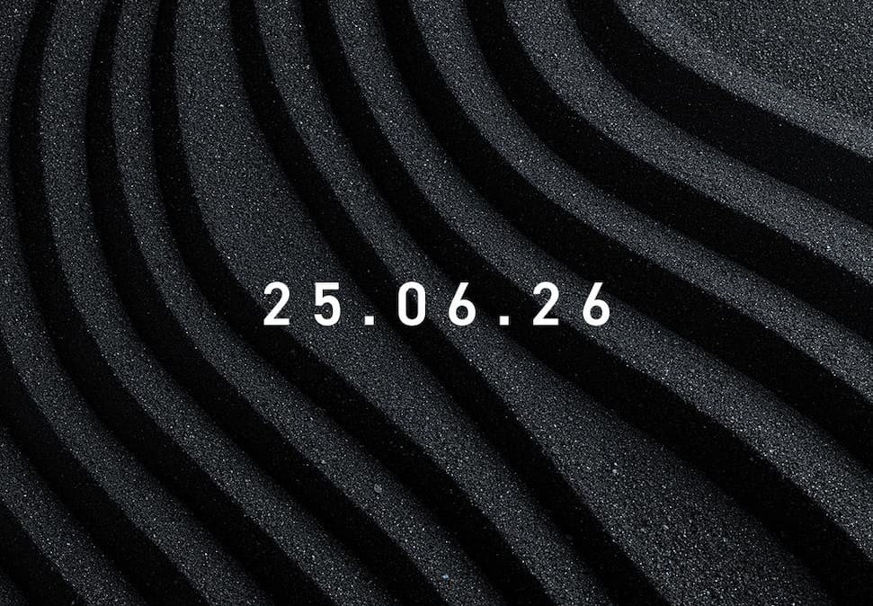 An Image of wavy black sand with the text 25.06.26