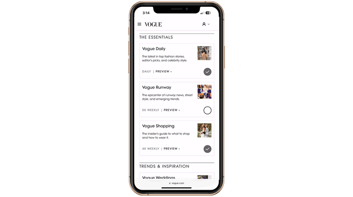 Phone and laptop displaying Vogue content.