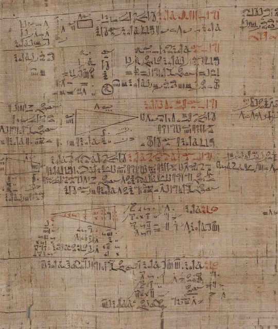 Section of the Rhind Mathematical Papyrus showing calculations involving pyramid-shaped structures. 