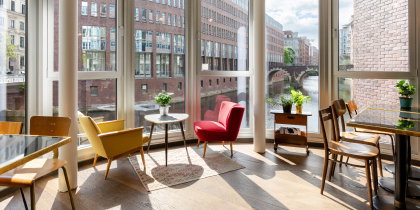 Tables next to floor-to-ceiling windows offer an ideal place for a sunny breakfast at Ruby Lotti Hotel.