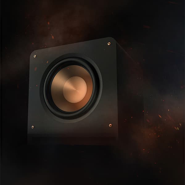 Klipsch Subwoofer on a dark and smokey background, with sparks flying