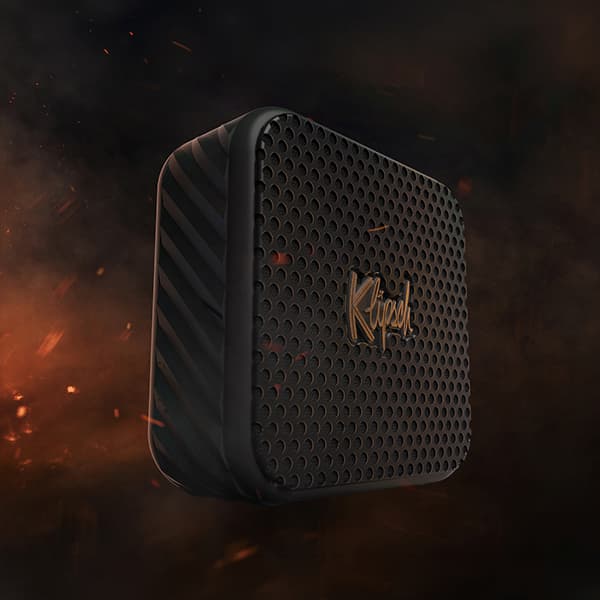 Klipsch Austin on a dark and smokey background, with sparks flying