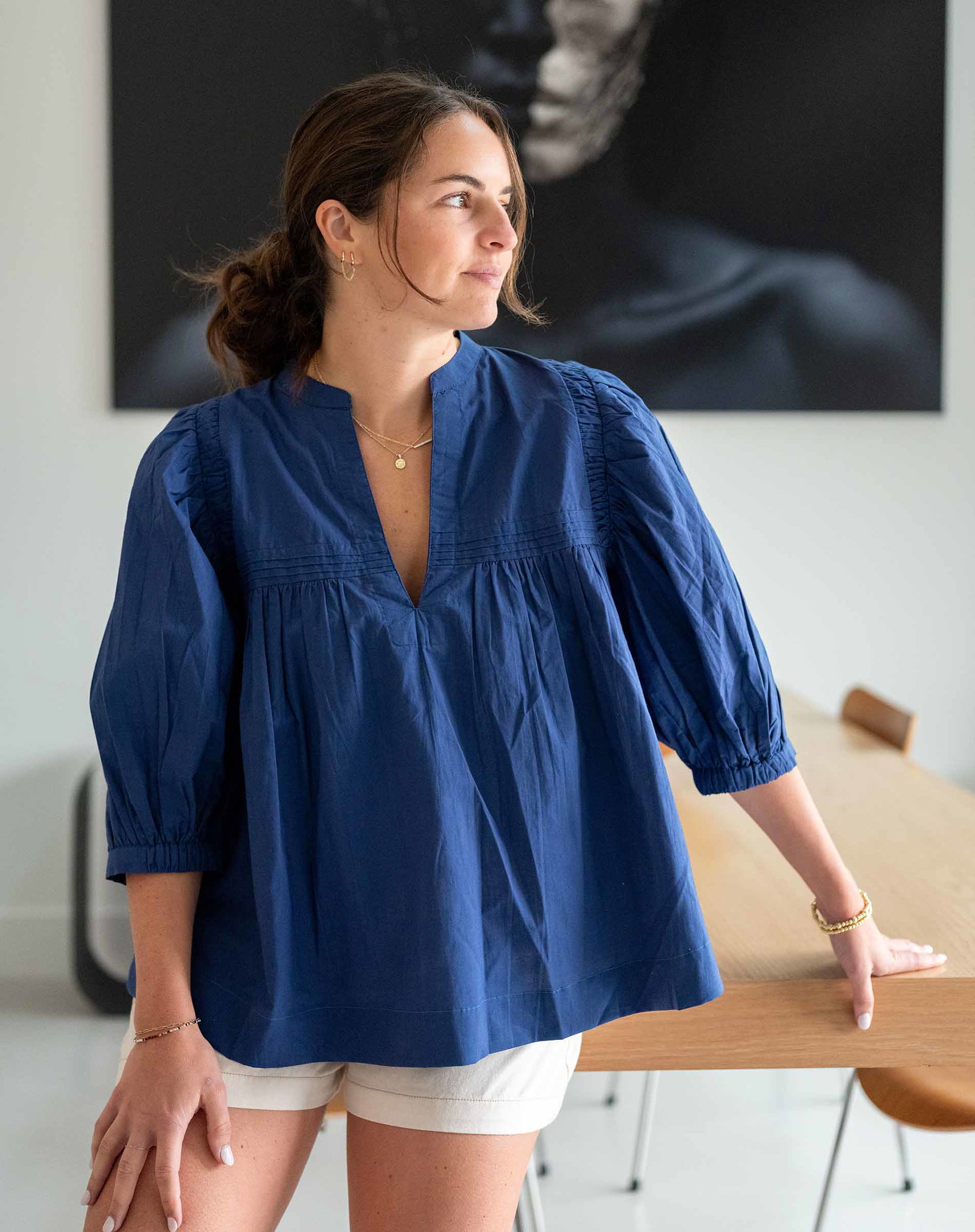 Image of a woman wearing a blue top
