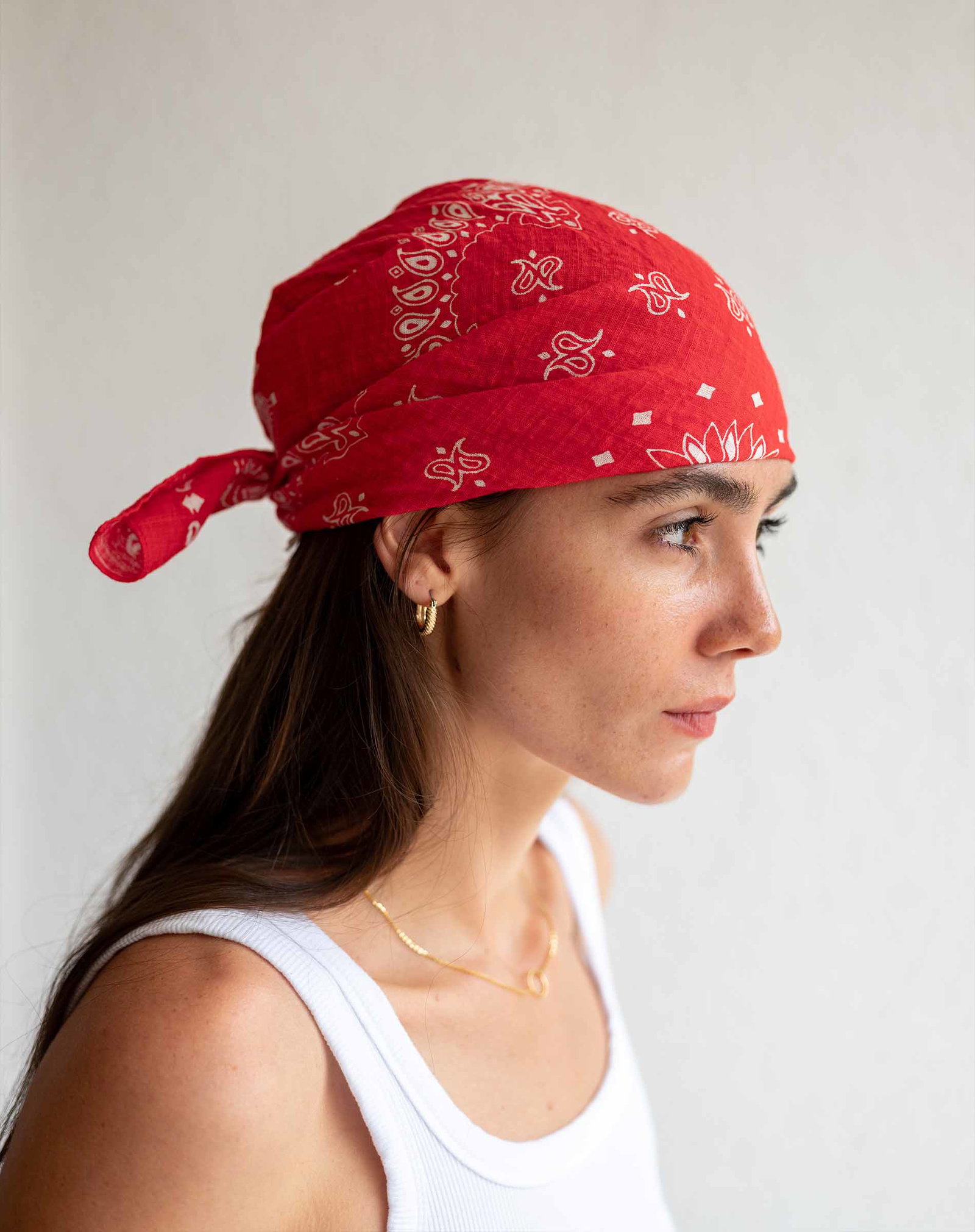 Image of a woman wearing a red bandana