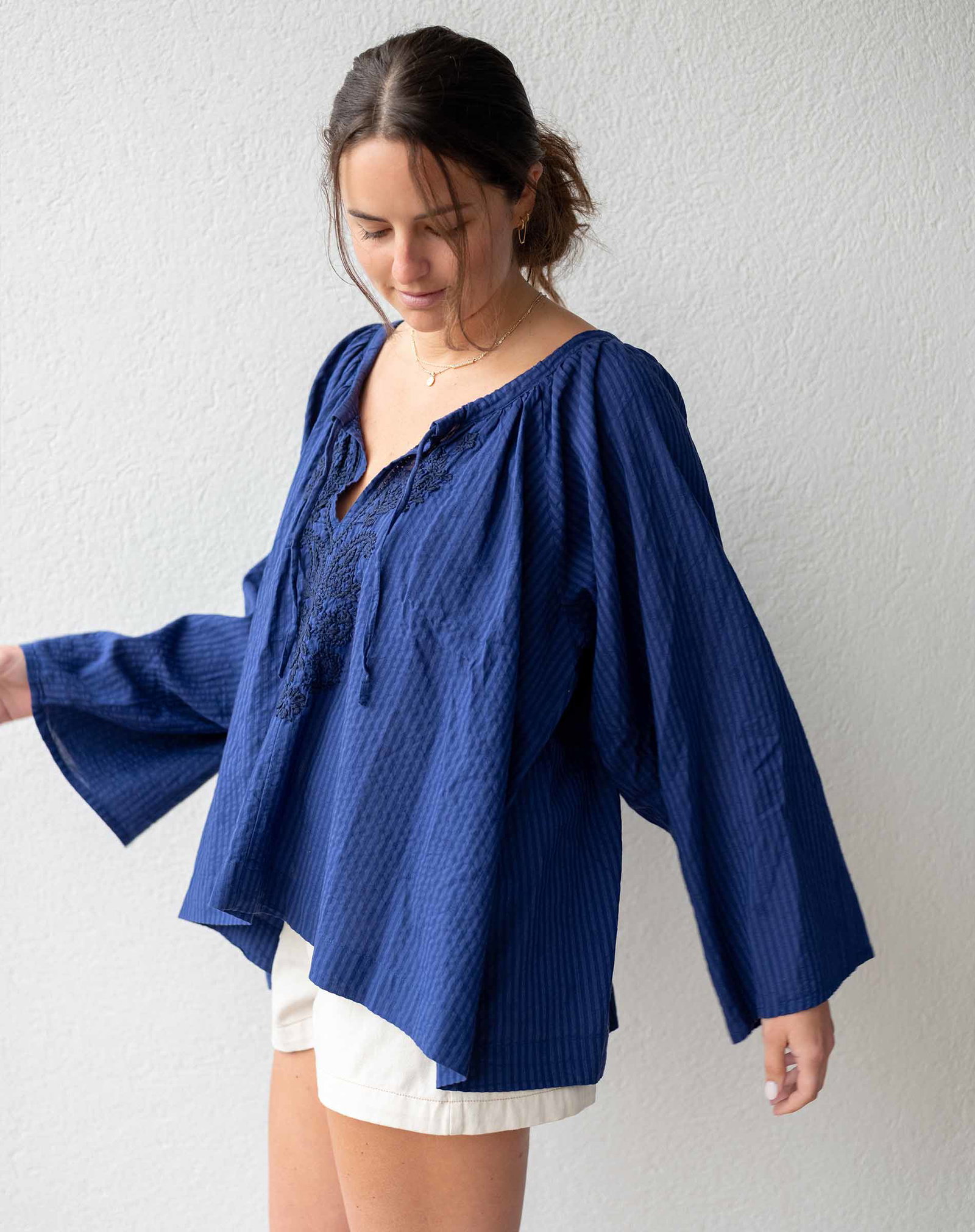 Image of a woman wearing a blue top