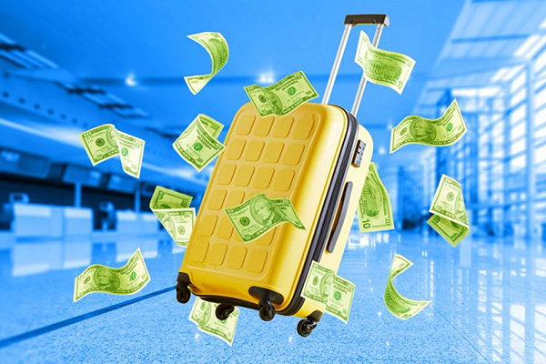 Luggage surrounded by cash.