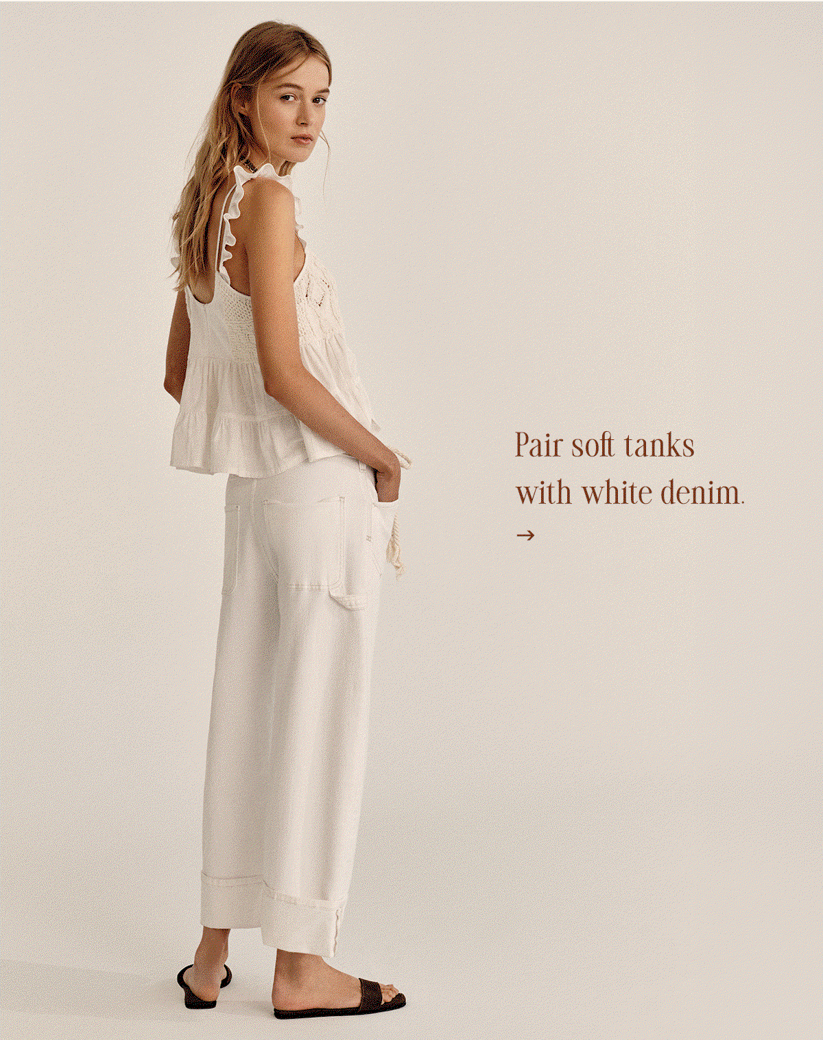 pairs soft tanks with white denim