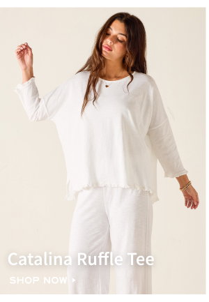 Catalina Ruffle Tee - Shop now - Image of a woman wearing a white long sleeve tee with ruffle details