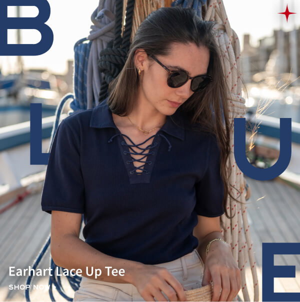 Earhart Lace Up Tee - Shop now - Image of a woman wearing a short sleeve navy lace-up tee.