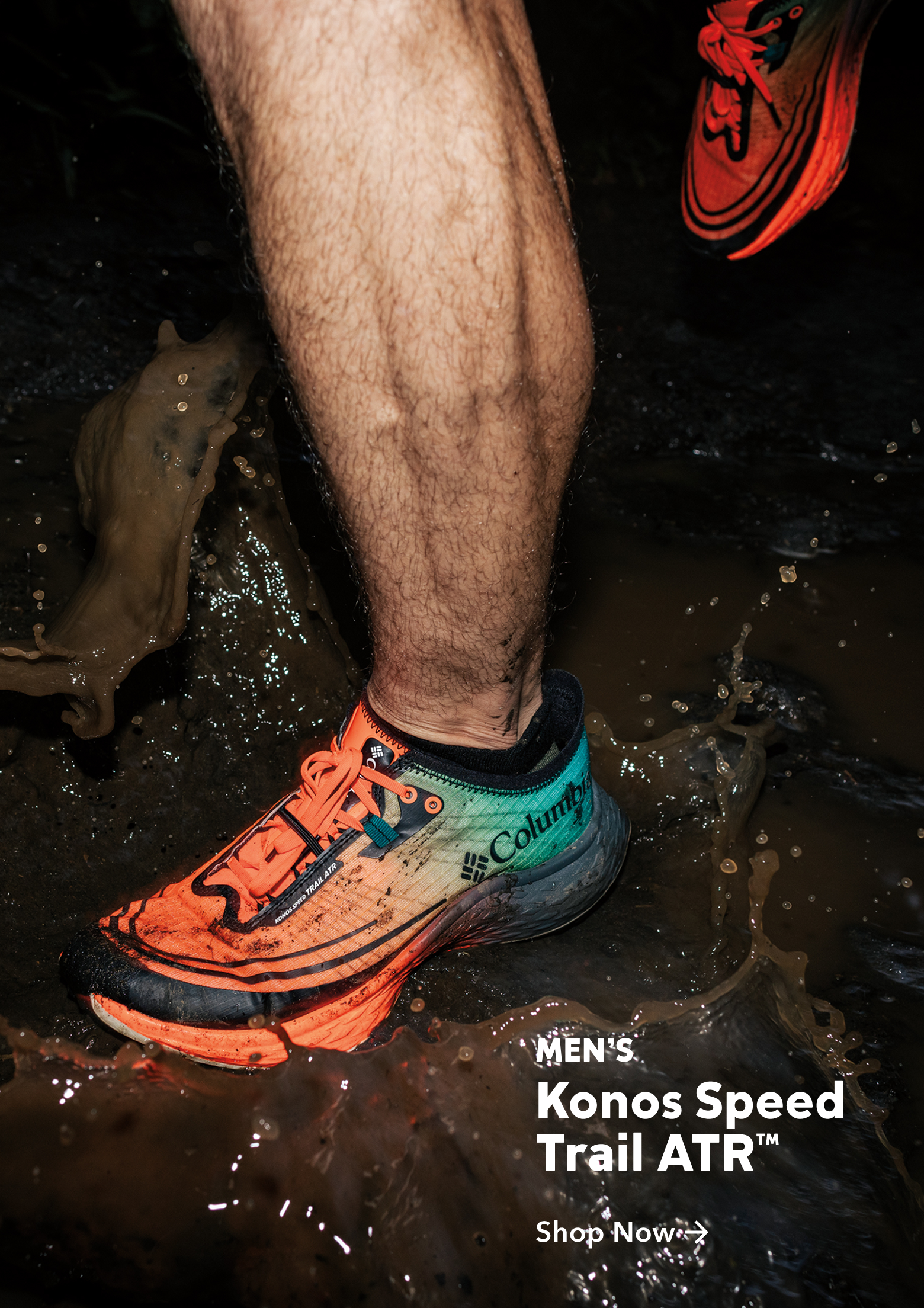 An image of a model stepping in a muddy puddle with the Konos Speed Trail ATR shoe. 