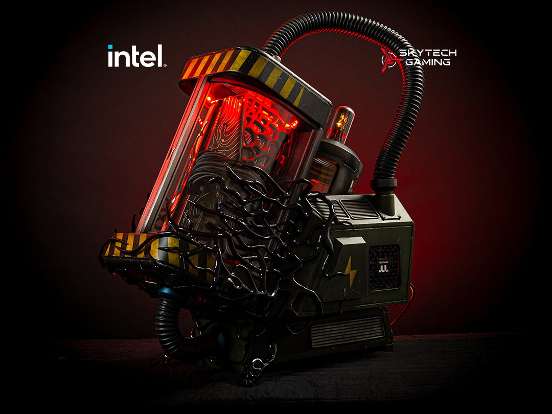 a PC in the shape of a containment tank with a monitor next to it.