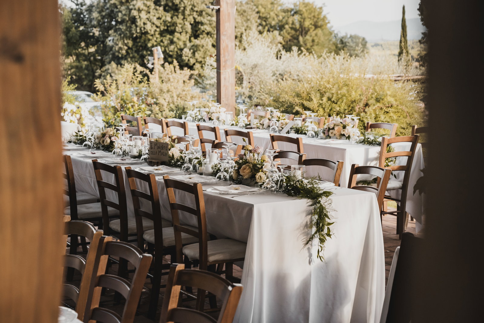 Outdoor summer table with French toile linens and floral centerpieces