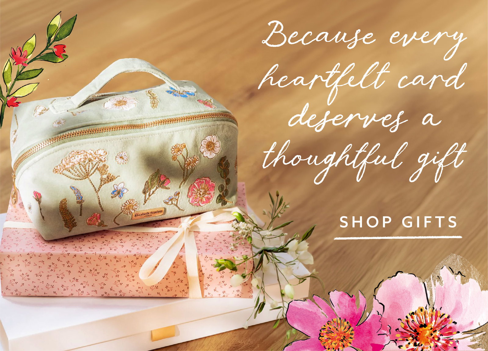 An embroidered floral cosmetic bag displayed on wrapped gifts with fresh flowers, promoting thoughtful gift ideas designed to complement special cards and meaningful occasions.