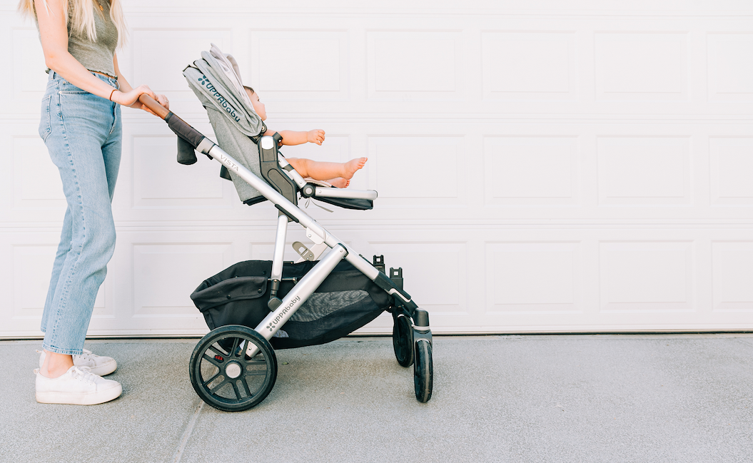 tall parent pushing a stroller