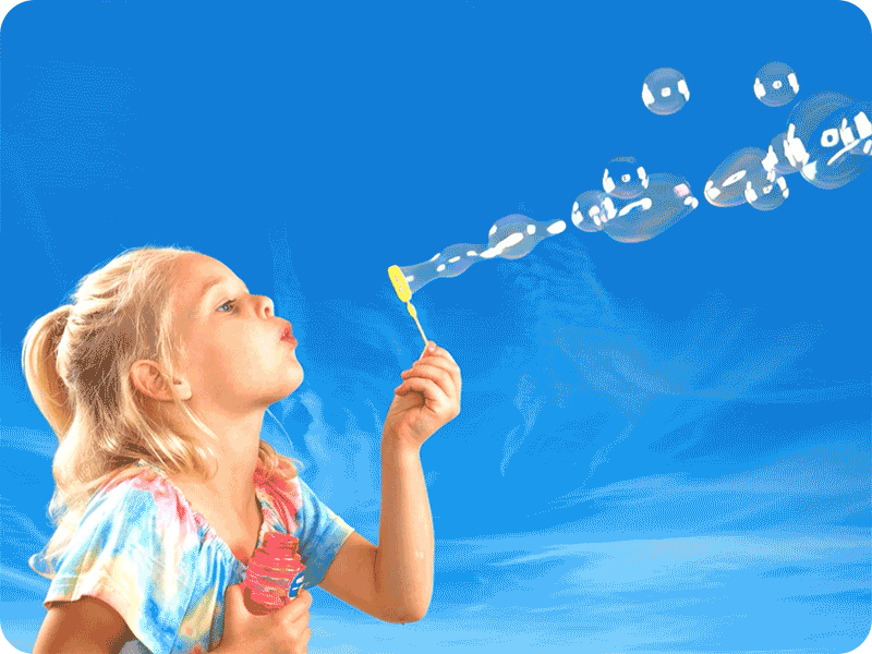 A girl blowing bubbles