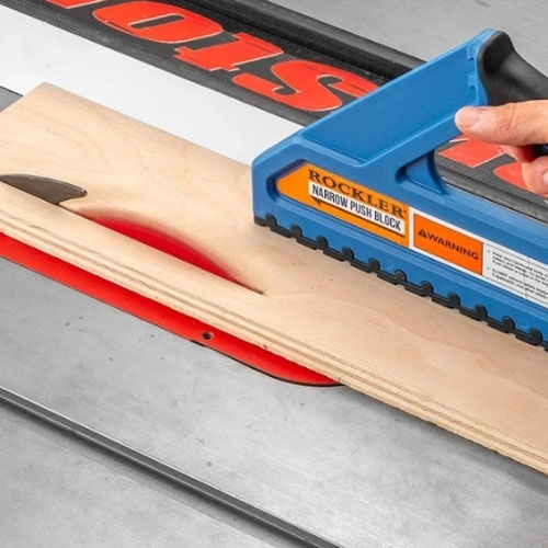 Pushing a cut across a table saw