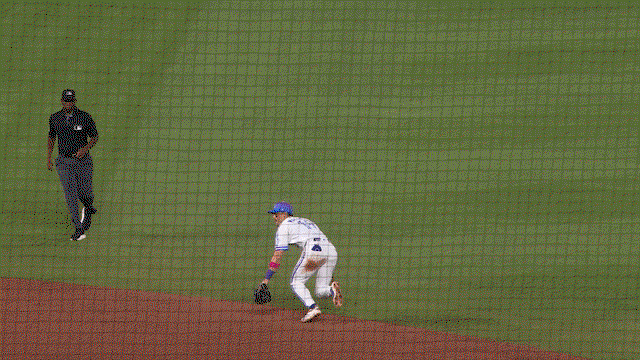 An animated gif of Michael Massey making a diving stop behind second base and flipping the ball to shortstop Tyler Tolbert, who spins and fires to first for the out
