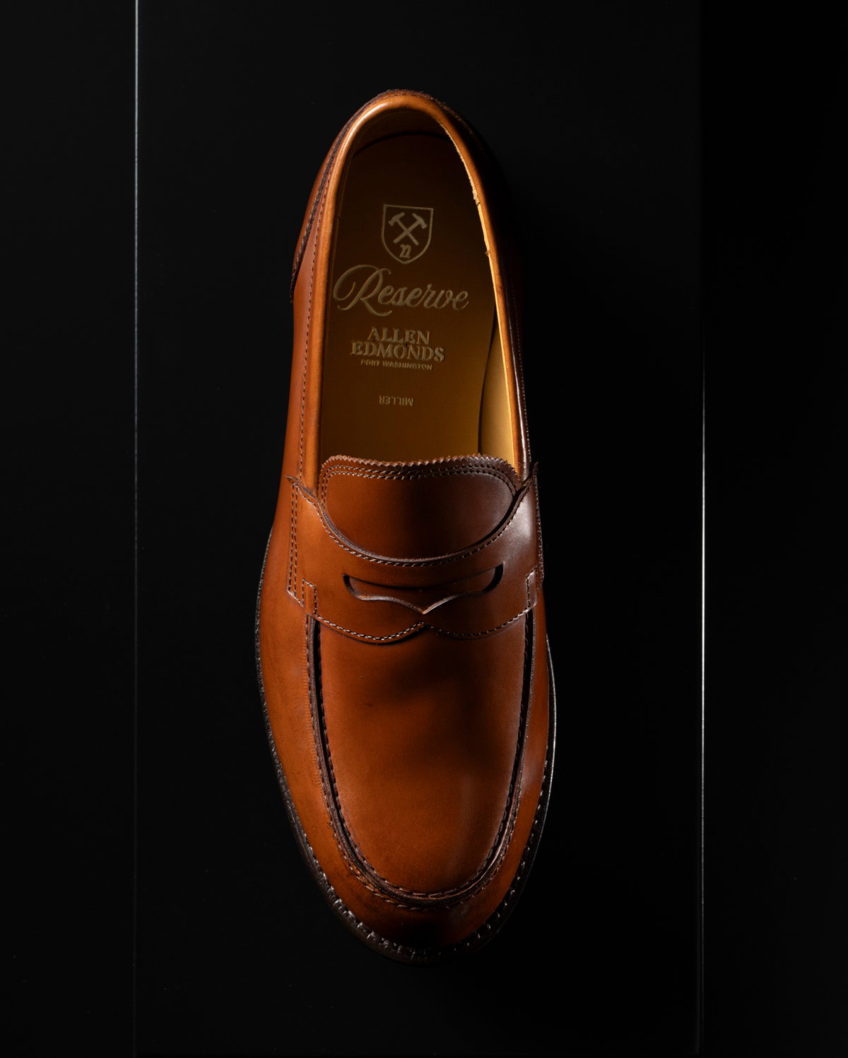 An overhead image of the Miller Reserve Penny Loafer in natural polished calf leather. Click here to shop now.
