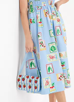 Effortless looks for her. From 24.99 womens dresses. A woman in a blue dress with watercolor prints on it.