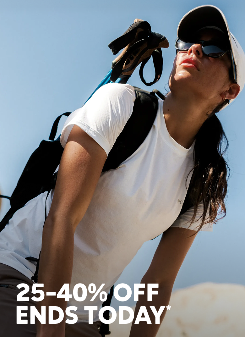 A woman hiking with trek poles on her back, she's looking up at the sun with her sunglasses on. Headline reads, 25–40% Off Ends Today.