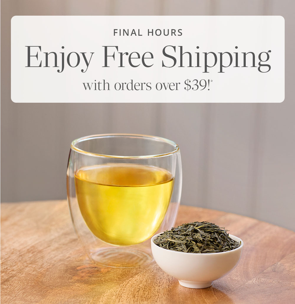 Japanese sencha tea in tea cup and loose leaf in a small white bowl