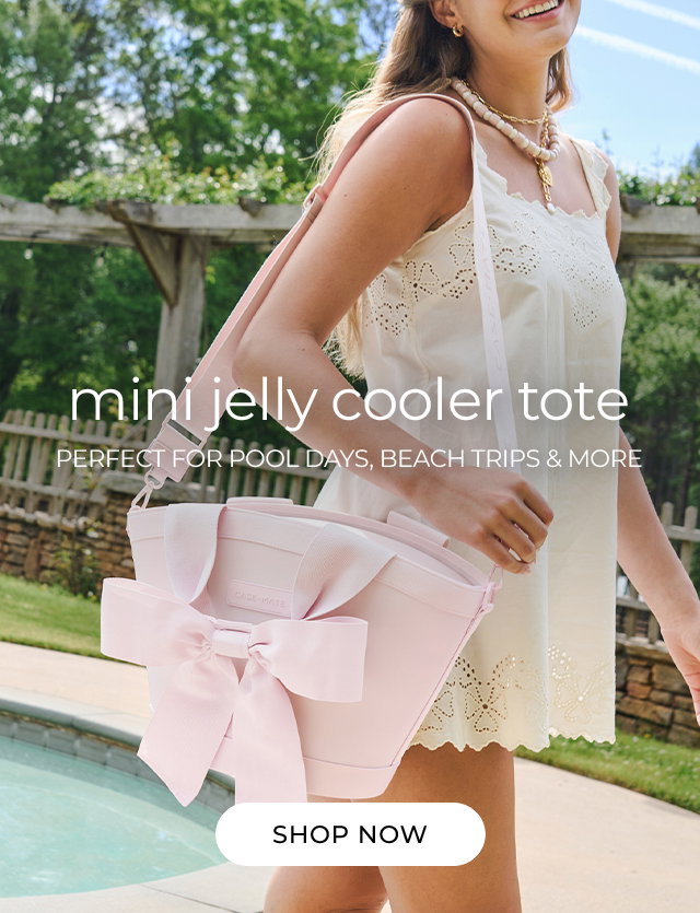 A gril at the pool carrying the Mini Jelly Cooler Tote over her shoulder.