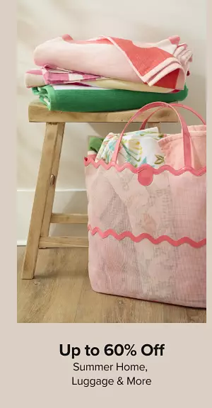 Up to 60% off summer home, luggage, and more. Shop now. A pink tote bag filled with beach towels.