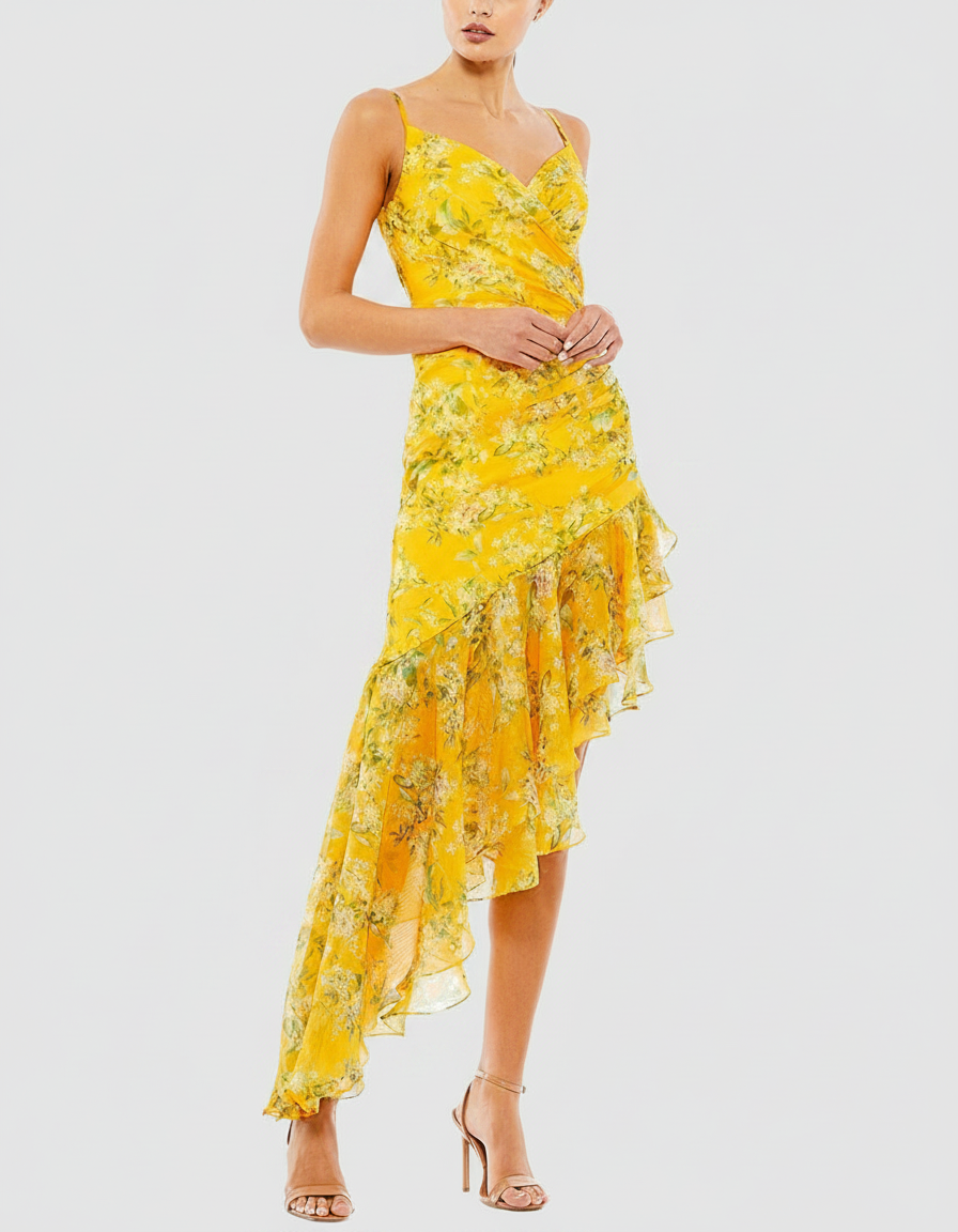 Woman in a yellow floral print dress with a ruffled, asymmetrical hem and strappy heels.