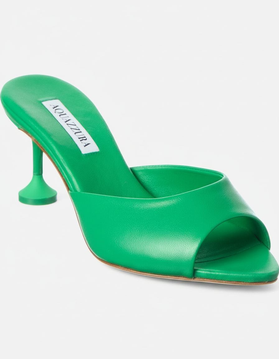 A green Aquazzura mule with a flared heel.
